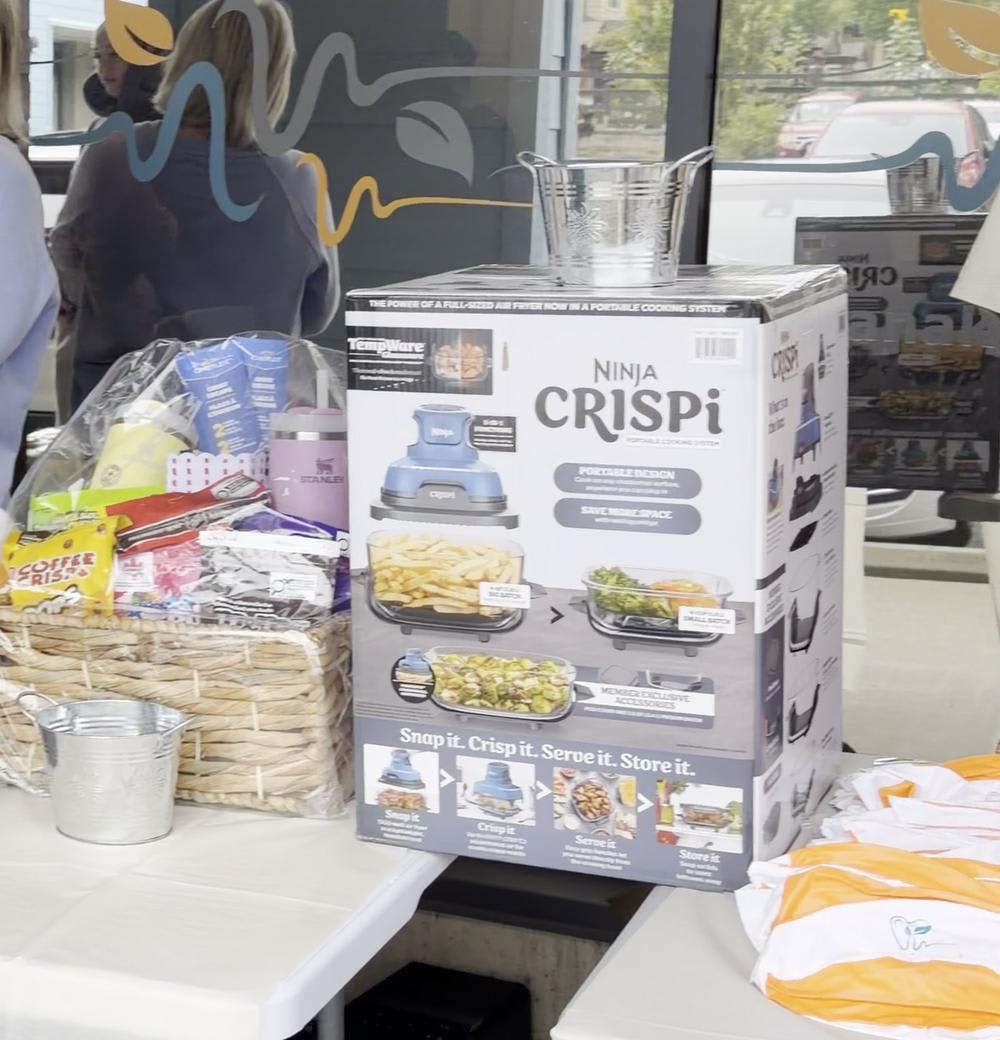 Prize table with gift baskets and giveaways at the Patient Appreciation Day