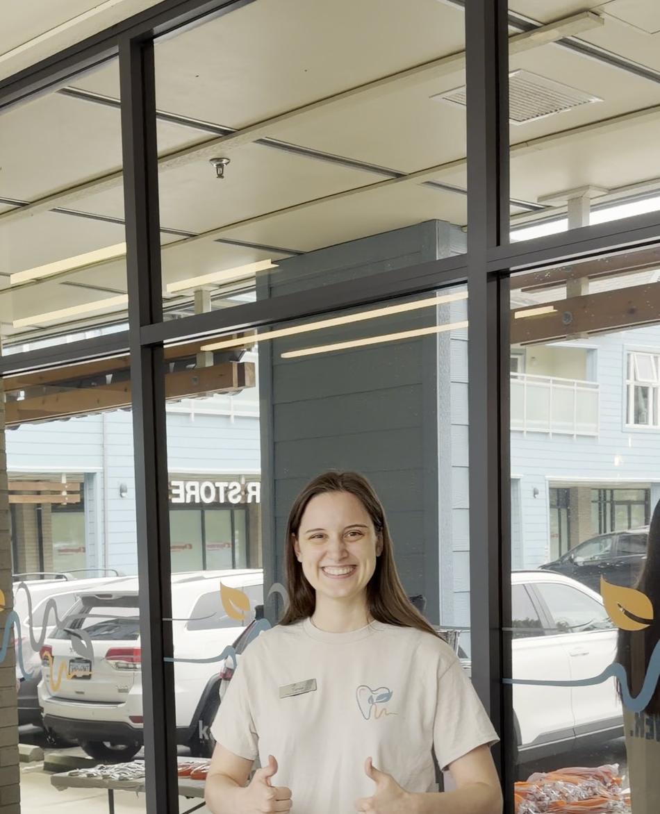 Kanaka Creek Family Dental team member welcoming families at the front table